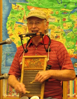 Thad Beach playing the washboard and harmonica